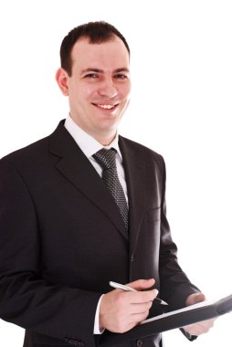 Smiling businessman with pen and notepad clipart