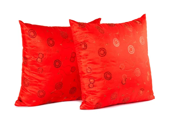 Två röda dekorativa kuddar med mönster — Stockfoto