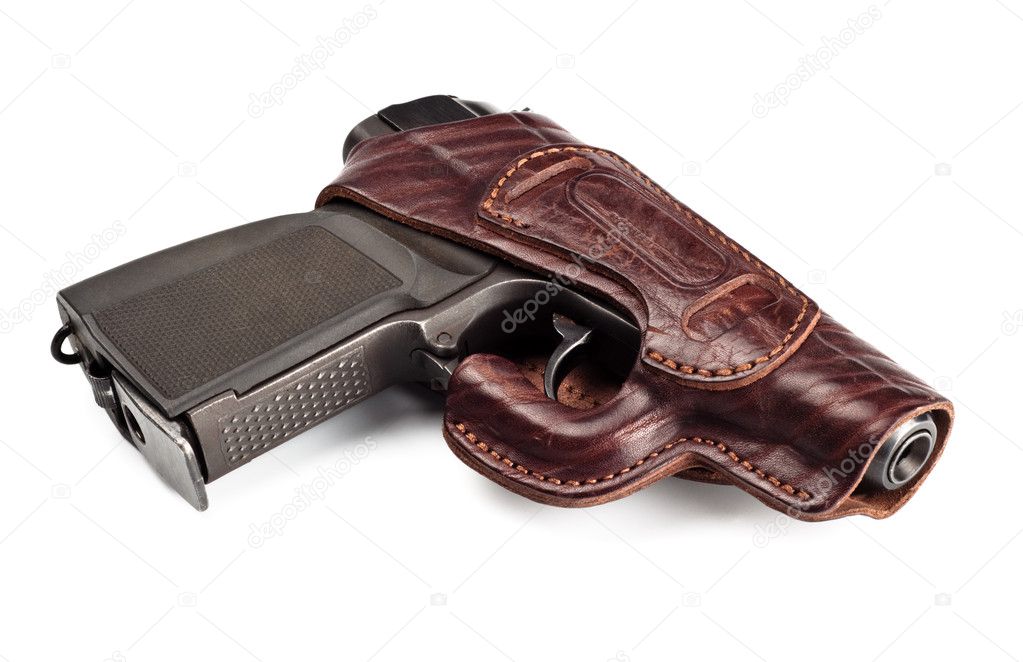 Vintage pistol in leather holster