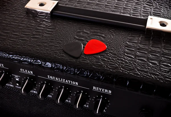Two plectrums on guitar amplifier — Stock Photo, Image