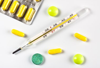 Thermometer and pills clipart