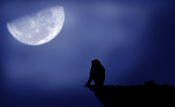 Black silhouette of a girl which sits under the moon