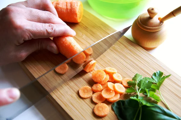 stock image Chopping raw carrot