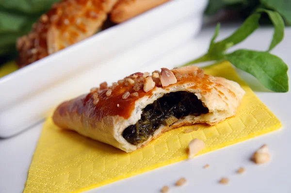 Bitten puff-pastry pasty filled in fresh — Stock Photo, Image