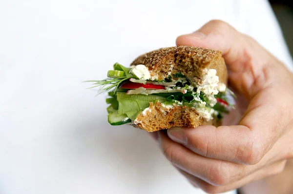 Bitten healthy sandwich on a man — Stock Photo, Image