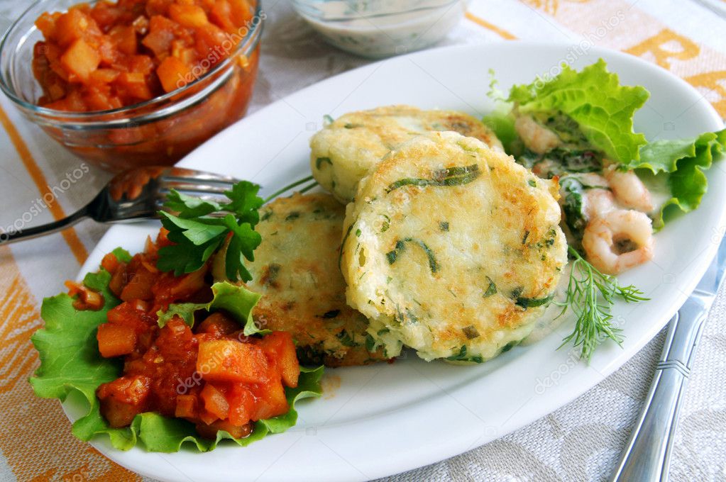 Potato and greens cakes with two sauces
