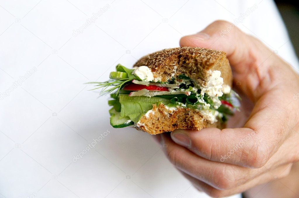 Bitten healthy sandwich on a man