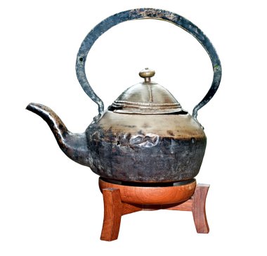 Ancient teapot on wood support. clipart