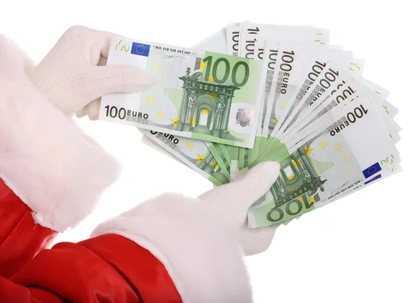 Geld in der Hand des Weihnachtsmannes. — Stockfoto
