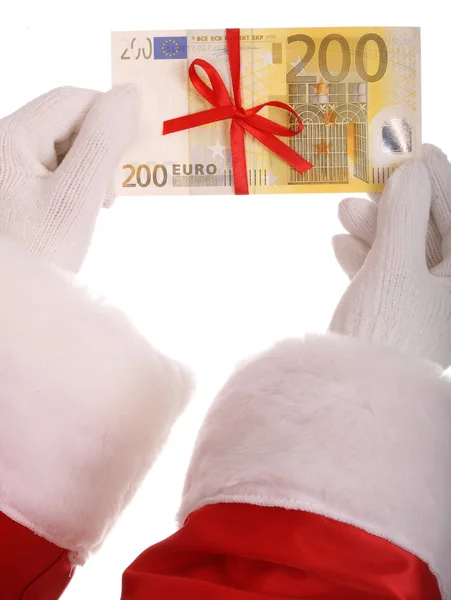 Geld in der Hand des Weihnachtsmannes. — Stockfoto