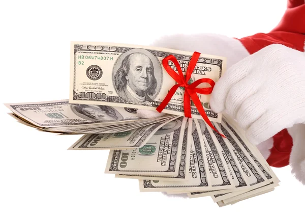 Pengar i handen av jultomten. — Stockfoto