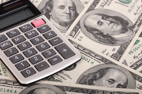 Calculator and dollars background. — Stock Photo, Image
