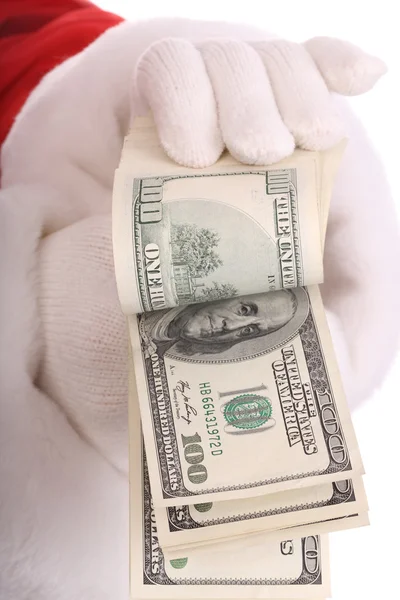 Geld in de hand van de Kerstman. — Stockfoto