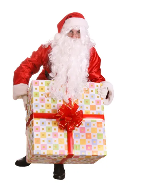 Jultomten ger stora presentförpackning — Stockfoto