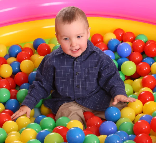Birthday of fun boy in balls. — Stock Photo, Image