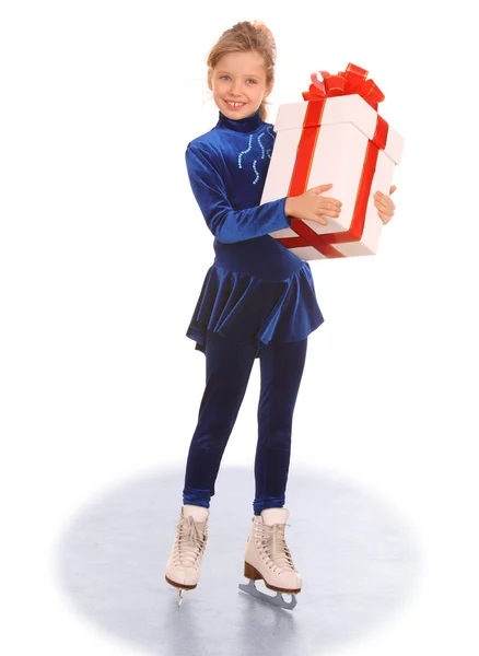 Girl in blue dress on skates. — Stock Photo, Image