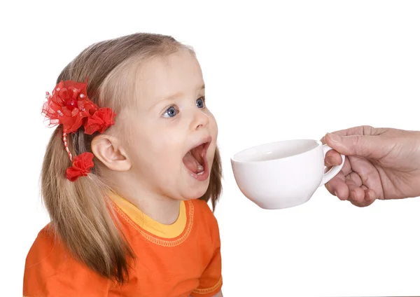 Child drink water from white cup. — Stock Photo, Image