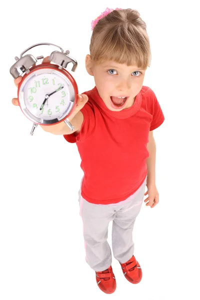 Girl in red t-shirt and alarm clock. — Stock Photo, Image