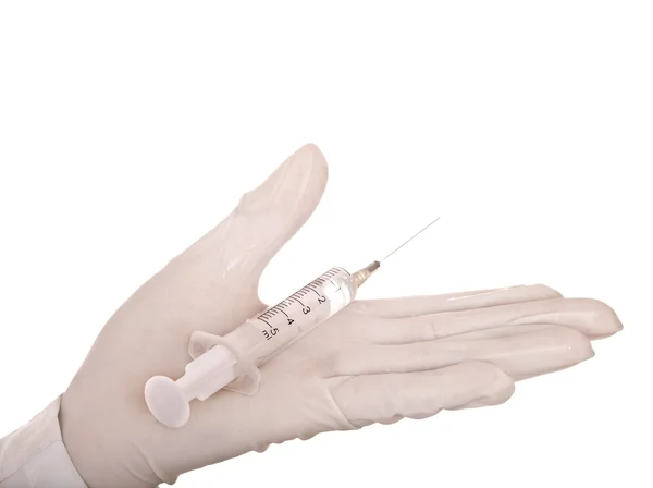 Hand in glove with syringe. — Stock Photo, Image