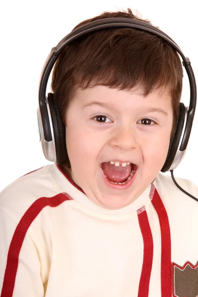 Pojke i hörlurar lyssna musik. — Stockfoto
