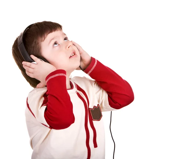 Niño en auriculares escuchar música . — Foto de Stock