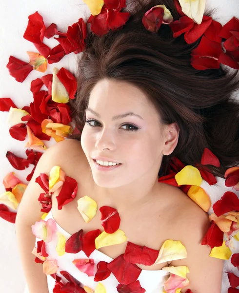 Beautiful girl in rose petal. — Stock Photo, Image