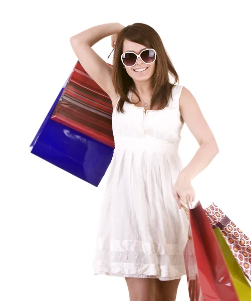 Meisje in glazen met cadeau zak winkelen. — Stockfoto