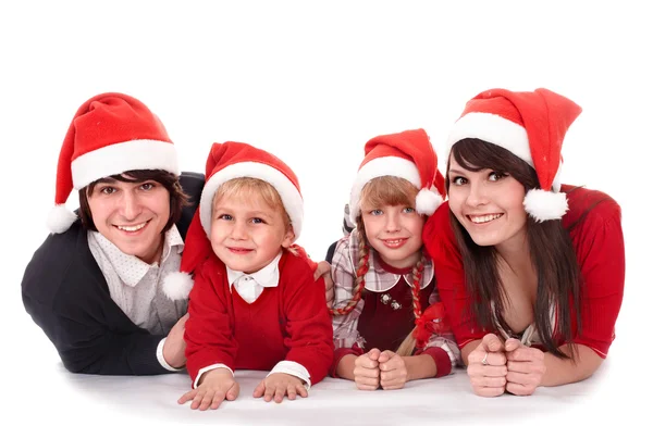 Ευτυχισμένη οικογένεια με παιδιά στην το καπέλο santa — Φωτογραφία Αρχείου