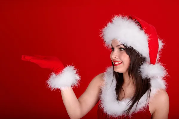 Різдвяна дівчина в червоному капелюсі Санта . — стокове фото