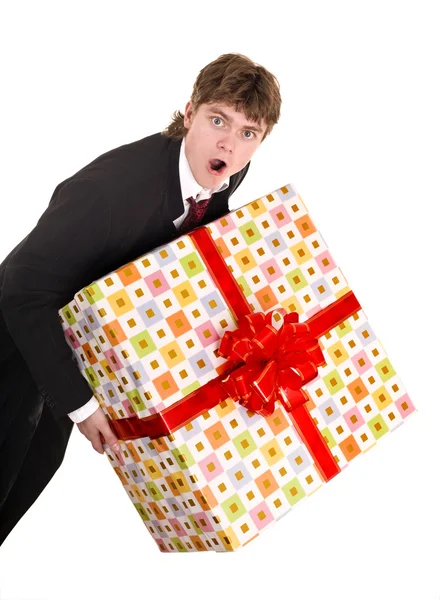 Man with falling gift box run. Royalty Free Stock Photos