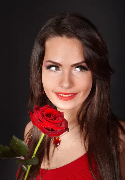 Κορίτσι με τριαντάφυλλο σε γκρι φόντο. — Φωτογραφία Αρχείου