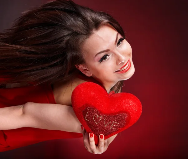 Girl with heart in red flying. — Stock Photo, Image