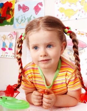 Child with chalk draw in playroom. clipart