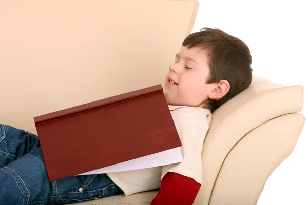 Divertido menino dormir com livro . — Fotografia de Stock
