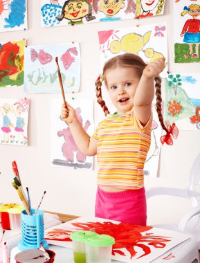 Child with picture and brush clipart