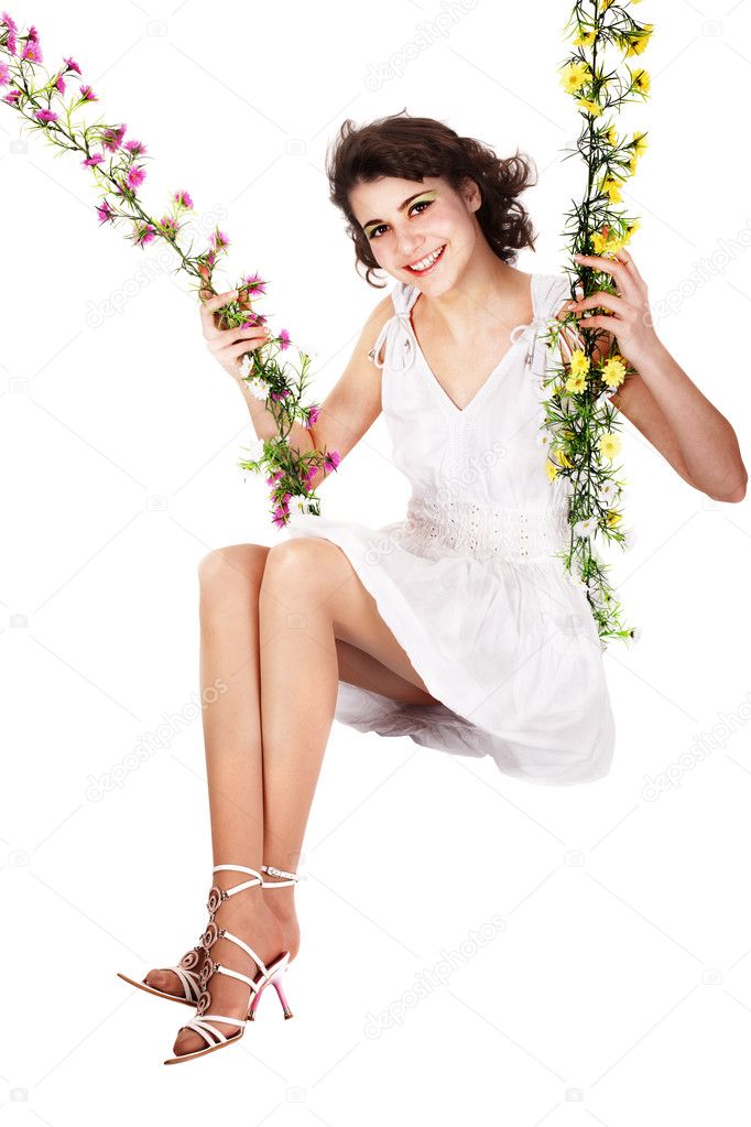 Girl swinging on flower swing.