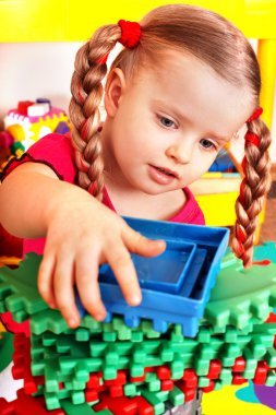 Child with block and construction set clipart