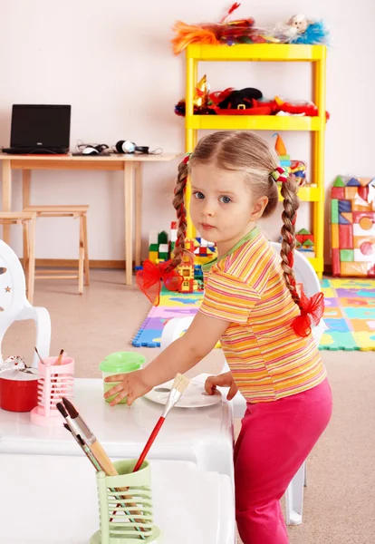 Child with paint and brush — Stock Photo, Image