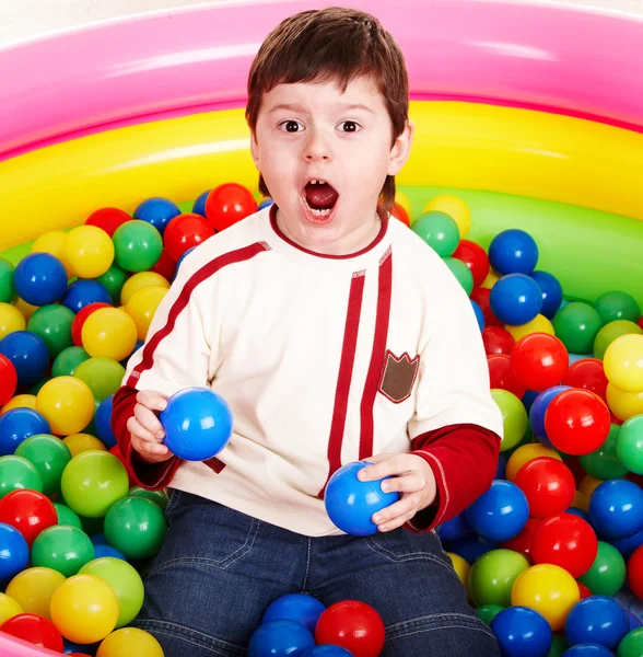 Happy birthday of little boy in balls. — Stock Photo, Image