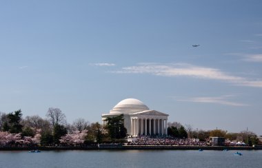 Plane taking off over Jefferson Memorial clipart