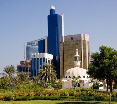 Mosque in front of office in Abu Dhabi clipart