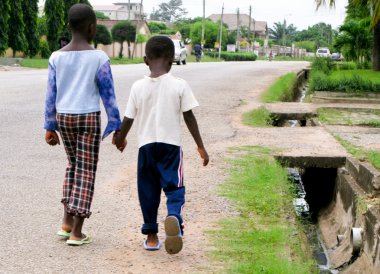 African boys on roadside clipart