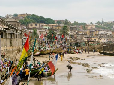 Boats on the beach on Cape Coast in Ghan clipart