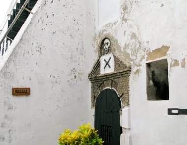 Entrance to slave cells at Elmina Fort i clipart