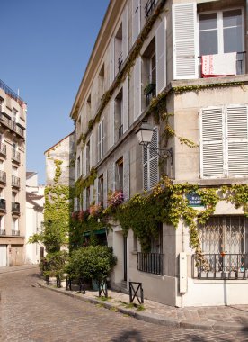 Old cobbled street in Montmartre in Pari clipart