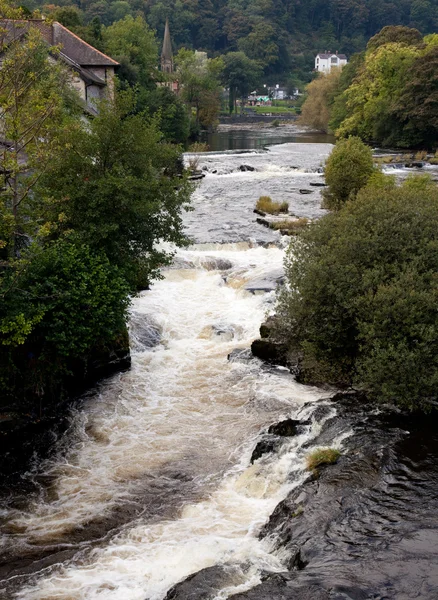 River runs rapidly through Llangollen in — Stock Photo, Image