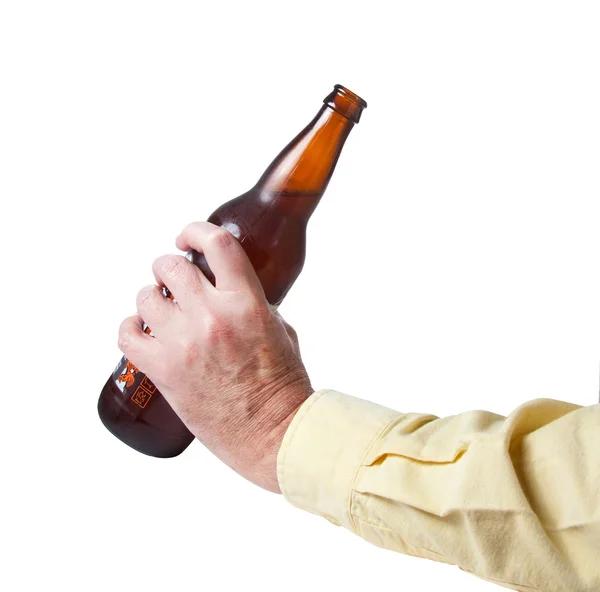 Brown bottle of beer in old hand — Stock Photo, Image