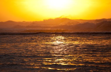 Orange sunset over Na Pali clipart