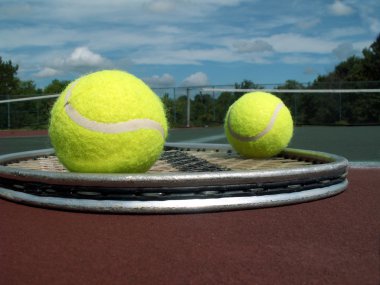 Tennis balls and racket clipart