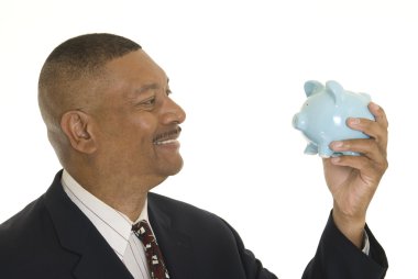 Businessman with piggy bank clipart